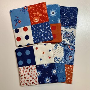 May include: Set of six fabric coasters with a patchwork design. Each coaster features a different combination of blue, red, and white patterns.
