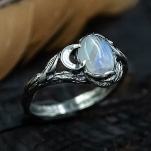 Moonstone Silver Ring with Ethereal Glow, Crescent Moon Accents, and Nature-Inspired Vine Detailing