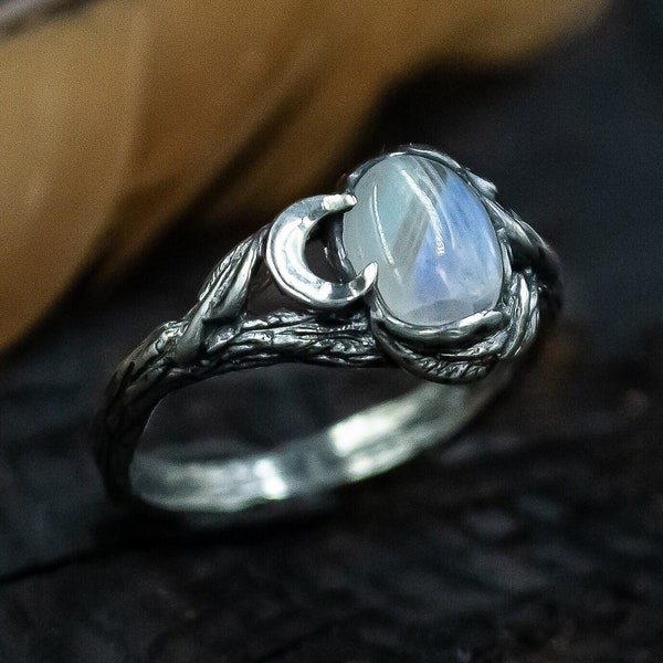 Moonstone Silver Ring with Ethereal Glow, Crescent Moon Accents, and Nature-Inspired Vine Detailing