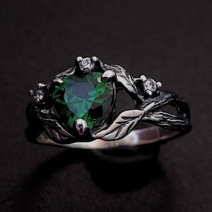 Silver Ring with Heart-Shaped Emerald and Leaf Details