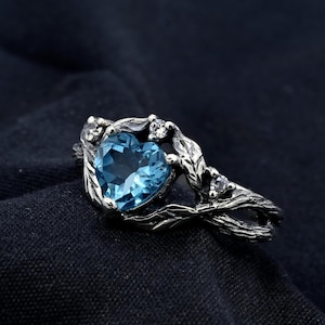 Silver Ring with Heart-Shaped Blue Topaz Centerpiece