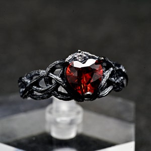 Silver Ring with Heart-Shaped Garnet and Twisted Branch Design