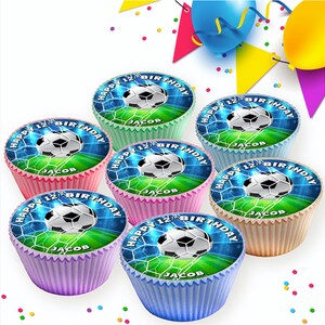 May include: Six colorful cupcakes with a soccer ball design and the text "Happy 12th Birthday Jacob" on each cupcake.