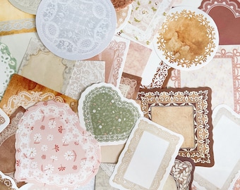 May include: Assortment of decorative paper doilies in various shapes, sizes, and patterns. The doilies are made of delicate lace and feature floral, geometric, and abstract designs. The doilies are in shades of white, brown, and green.