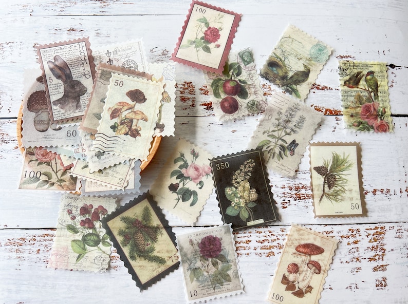 May include: A collection of vintage-style paper stamps with botanical and animal illustrations. The stamps feature images of roses, mushrooms, birds, and a rabbit, with various numerical values and decorative borders. The color palette includes muted tones of beige, brown, and green.