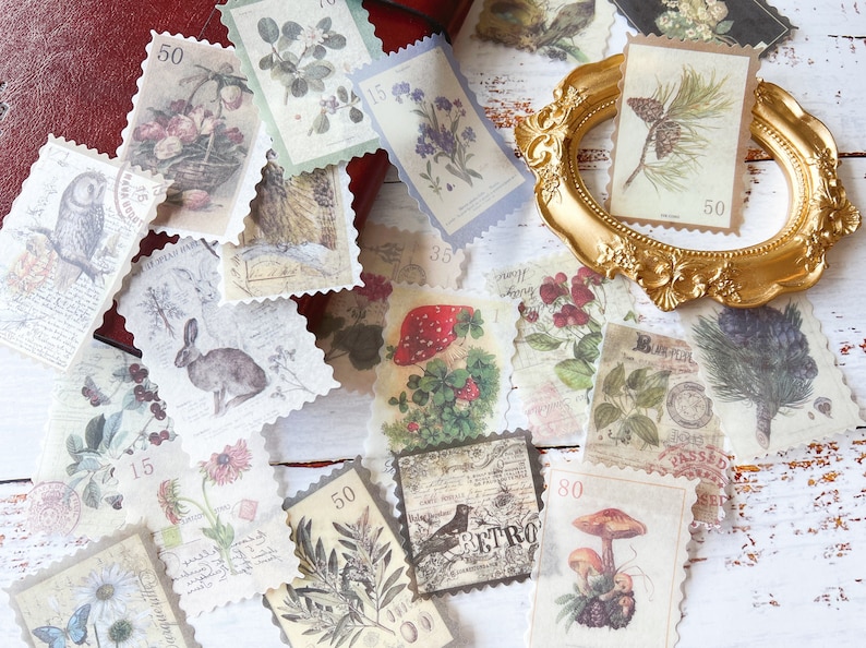 May include: A collection of vintage-style postage stamps with botanical and animal illustrations. The stamps feature images of flowers, mushrooms, an owl, a rabbit, and other nature-themed designs. Some stamps have a value of 50, 15, or 35. The stamps are arranged on a red surface.