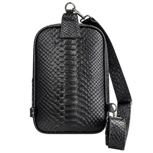 Genuine black python snakeskin sling backpack front view with adjustable strap and silver hardware