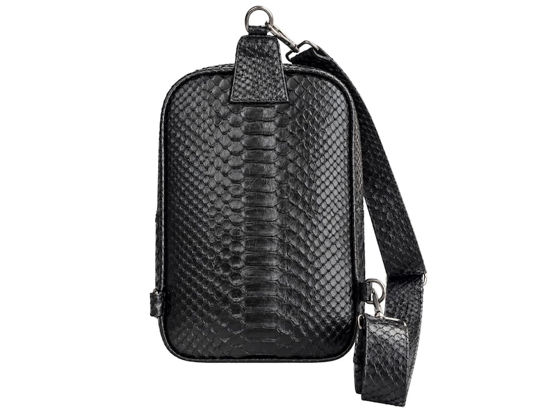 Genuine black python snakeskin sling backpack front view with adjustable strap and silver hardware