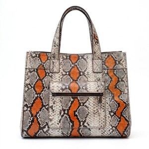 Front view of orange genuine python snakeskin tote bag with zip pocket