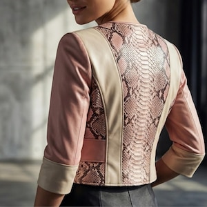 Model wearing blush leather snakeskin jacket indoor styling