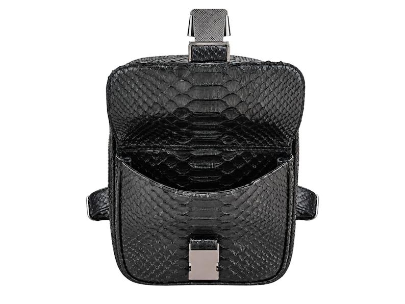 Rear view of black python snakeskin backpack showing back panel and adjustable strap construction