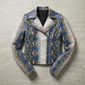 May include: A moto-style jacket featuring a vibrant snakeskin pattern in shades of blue, green, white, and brown. The jacket includes a notched lapel, an asymmetrical front zipper closure, two zippered side pockets, and a solid black interior lining.