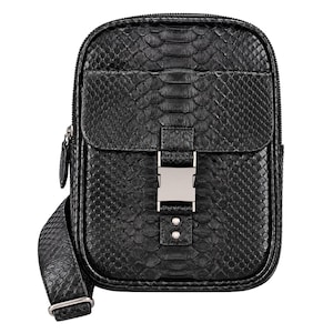 Black genuine python snakeskin crossbody sling backpack front detail with natural scale pattern and metal buckle