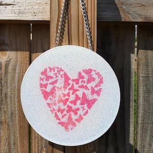 Glittery white handmade wall hanging with holographic pink butterfly design