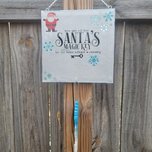 Santa&#39;s Magic Key Wall Hanging: Glittery Glow-in-the-Dark Resin Key