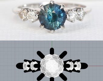 May include: A silver ring featuring a large, round, teal-blue gemstone as the centerpiece, flanked by smaller, clear gemstones. The ring's design includes a detailed setting that holds the stones securely. The ring is displayed on a white surface.