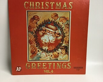 May include: A red vinyl record album cover with a gold title "Christmas Greetings Vol. 4" and a vintage illustration of Santa Claus surrounded by children. The album cover has a gold "AP" logo in the bottom left corner.