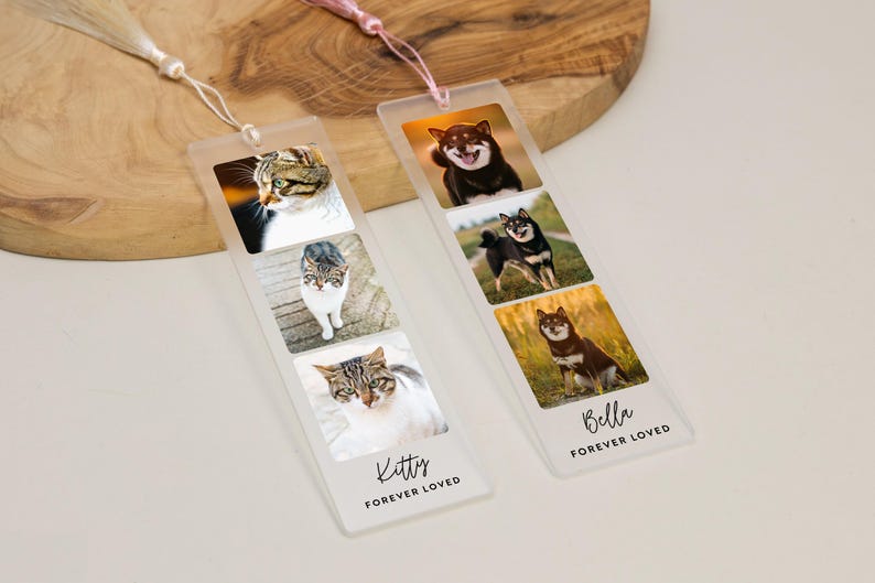 May include: Two clear acrylic bookmarks with photos of pets. One bookmark features three cat photos and the text "Kitty FOREVER LOVED." The other bookmark has three dog photos and the text "Bella FOREVER LOVED."
