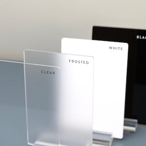 May include: Four acrylic sheets in different finishes: clear, frosted, white, and black. Each sheet has its finish name printed on it.