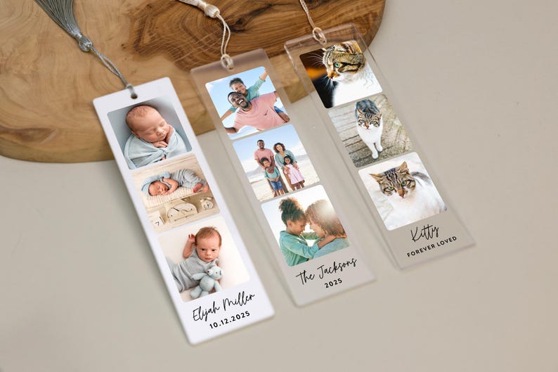 May include: Three personalized bookmarks with photos. One features baby photos and the name "Elyah Miller" and date. Another has family photos with "The Jacksons" and the year 2025. The third shows cat photos with the text "Kittys FOREVER LOVED".