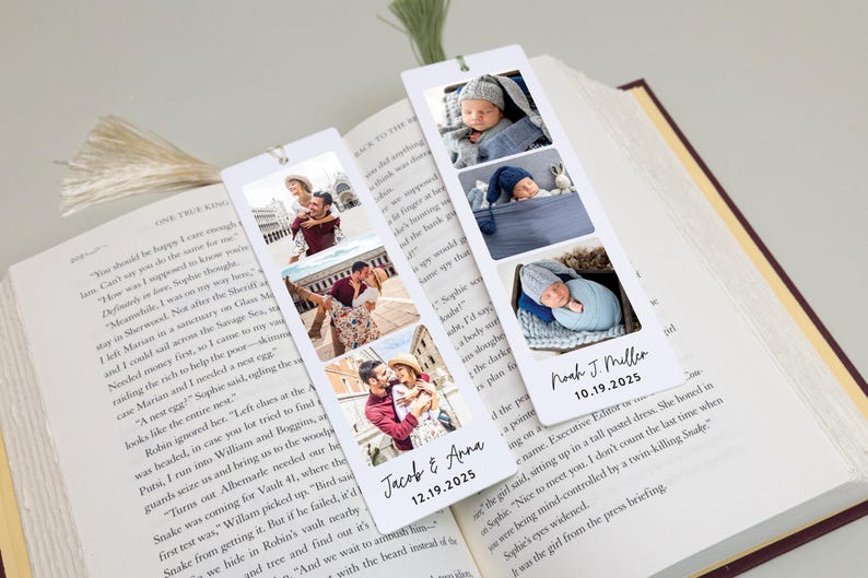 May include: White rectangular bookmarks with photos of a couple and a baby. One bookmark has photos of a couple with the text "Jacob & Anna 12.19.2025". The other bookmark has baby photos with the text "Noah J. Miller 10.19.2025".