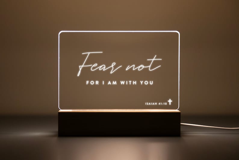 Personalized LED light featuring the inspirational Bible verse "Fear not, for I am with you" from Isaiah 41:10, engraved on a clear acrylic plaque with a warm wooden base. Perfect for home décor, prayer corners, or as a thoughtful Christian gift.