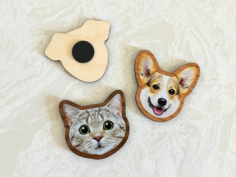 Custom face-shaped photo magnets. Featuring cutout designs of pet and baby faces. Perfect for decorating refrigerators, lockers, or any magnetic surface.