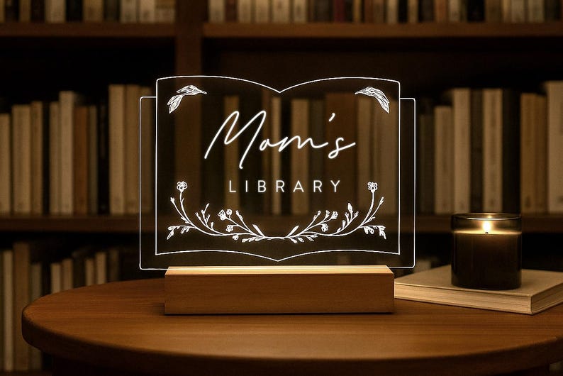 Personalized Library Sign on a clear acrylic book-shaped plaque, featuring floral details and a wood LED base.