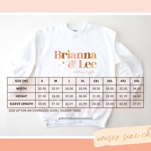 May include: White sweatshirt with the text "Brianna & Lee clothing & gifts" in a peach and gold color scheme. A size chart is included, showing measurements in inches for width, height, and sleeve length for sizes S to 5XL.