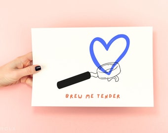 May include: A white card with a black and white illustration of a coffee portafilter with a blue heart drawn inside. The text "Brew me tender" is written in orange below the illustration.
