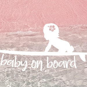 May include: White silhouette of a baby on a surfboard with the text "baby on board" and a small fish illustration. The background is a pink and white ombre with a water-like texture.