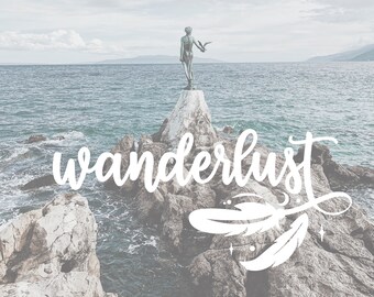 May include: A statue of a woman with a bird on her shoulder stands on a rocky outcropping overlooking the ocean. The word "wanderlust" is written in white script over the image.