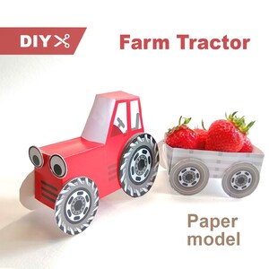 May include: A red paper model farm tractor with large wheels and googly eyes, pulling a trailer filled with fresh red strawberries. The image includes the text DIY, a scissor icon, Farm Tractor, and Paper model in a clear, bold font style.