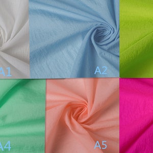 K&ouml;nnte beinhalten: Sechs Stoffmuster in verschiedenen Farben: Wei&szlig;, Hellblau, Limettengr&uuml;n, Hellgr&uuml;n, Pfirsich und Pink. Die Muster sind in zwei Reihen mit jeweils drei Mustern angeordnet, mit den Bezeichnungen A1 bis A6.