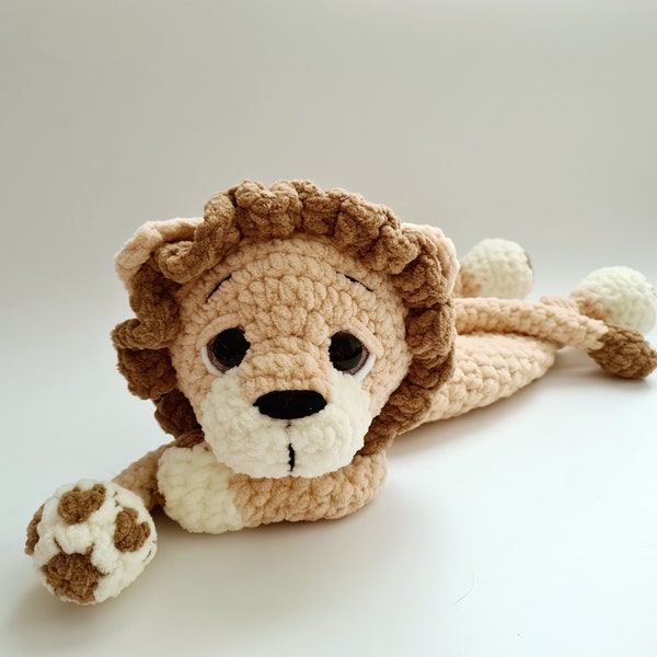 Adorable crochet lion snuggler toy, Soft & safe cuddle buddy for kids, Plush stuffed lion comforter