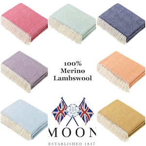 May include: A set of ten 100% Merino Lambswool throws in various colors, including pink, blue, green, purple, orange, and yellow. Each throw features a herringbone pattern and a fringe border. The throws are arranged in two rows of five, with the brand name "MOON ESTABLISHED 1837" displayed in the center.