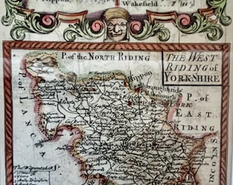 May include: An antique map of Yorkshire, England, showing roads, place names, and geographical features. The map has decorative borders and text boxes, with a vintage aesthetic. The text includes measurements in miles.