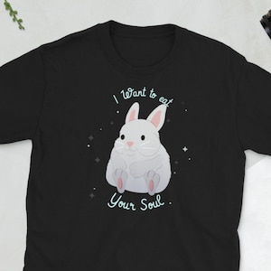 May include: Black t-shirt featuring a white rabbit illustration and the text "I want to eat your soul."