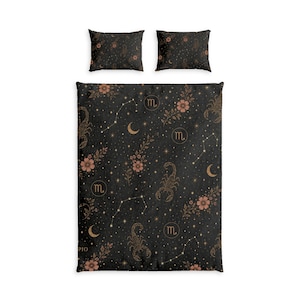 May include: A black bedding set consisting of a duvet cover and two pillowcases featuring a repeating pattern of gold scorpions, crescent moons, star constellations, floral sprigs, and the Scorpio zodiac symbol in a circular gold frame.
