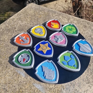 Paw Patrol badge: Chase, Stella (Skye), Marcus (Marshall), Ruben (Rubble), Zuma, Rocky, Evrest, Tracker, Liberty and Rex