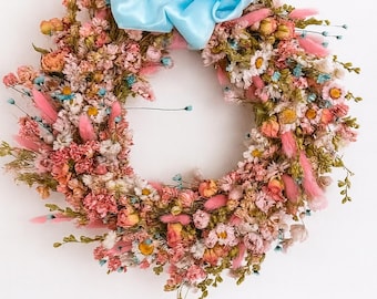 Handmade Dried Flower Wreath, pretty room decoration of Pink & Blue dried mixed flowers finished with a blue Satin Ribbon.