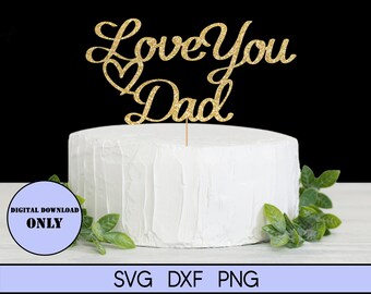 May include: Gold glitter cake topper with the text "Love You Dad" and a heart. The topper is on top of a white cake.