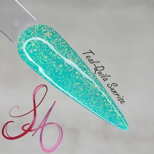 May include: Teal-Quila Sunrise nail polish with a turquoise and iridescent glitter finish.