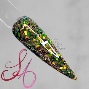 May include: A close-up of a green, gold, and black glitter nail dip powder. The powder is in a clear container and has a shiny, iridescent finish. The text "Lethal" is written on the container.