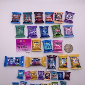 May include: A collection of miniature candy bar wrappers, including Peeps, Oreo, and other popular brands. The wrappers are arranged in rows and are all different colours and designs. The wrappers are all about 2.5 cm in size.