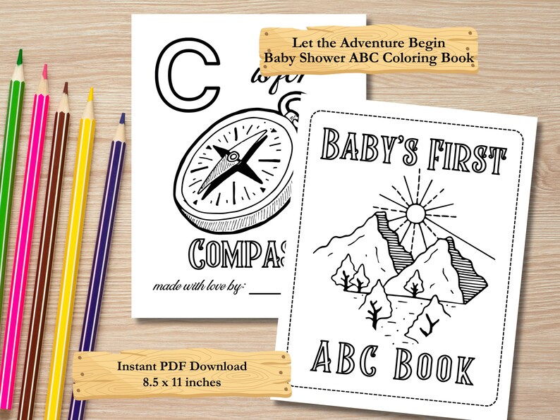 Op de afbeelding: Zwart-witte printbare kleurboek voor een babyshower. De omslag toont een kompas en bergen met de tekst "Let the Adventure Begin Baby Shower ABC Coloring Book" en "Baby's First ABC Book".