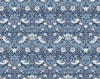 May include: A patterned fabric featuring a repeating design of birds, flowers, and foliage in shades of blue and white. The design is symmetrical and detailed, with a vintage aesthetic. The fabric is measured with a ruler in inches.