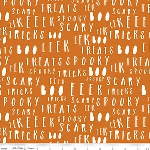 May include: Orange fabric featuring white text with Halloween-themed words such as "Pooky", "Scary", "Treats", "Eek", "Spooky", and "Tricks". The words are in a handwritten style.