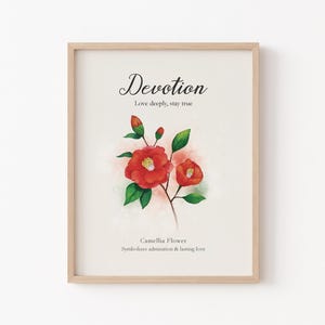 May include: A framed print featuring a watercolor illustration of a red camellia flower with green leaves and buds. The print includes the word "Devotion" in elegant script, along with the phrases "Love deeply, stay true" and "Camellia Flower symbolizes admiration & lasting love."
