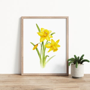 Pode incluir: Uma pintura em aquarela de narcisos amarelos com caules e folhas verdes em uma moldura branca simples.
